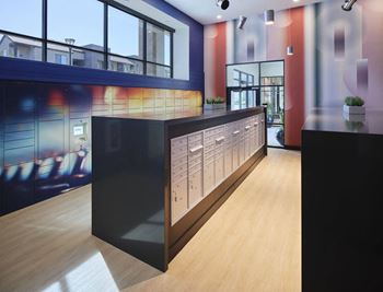 a long counter in a lobby of a building with windows